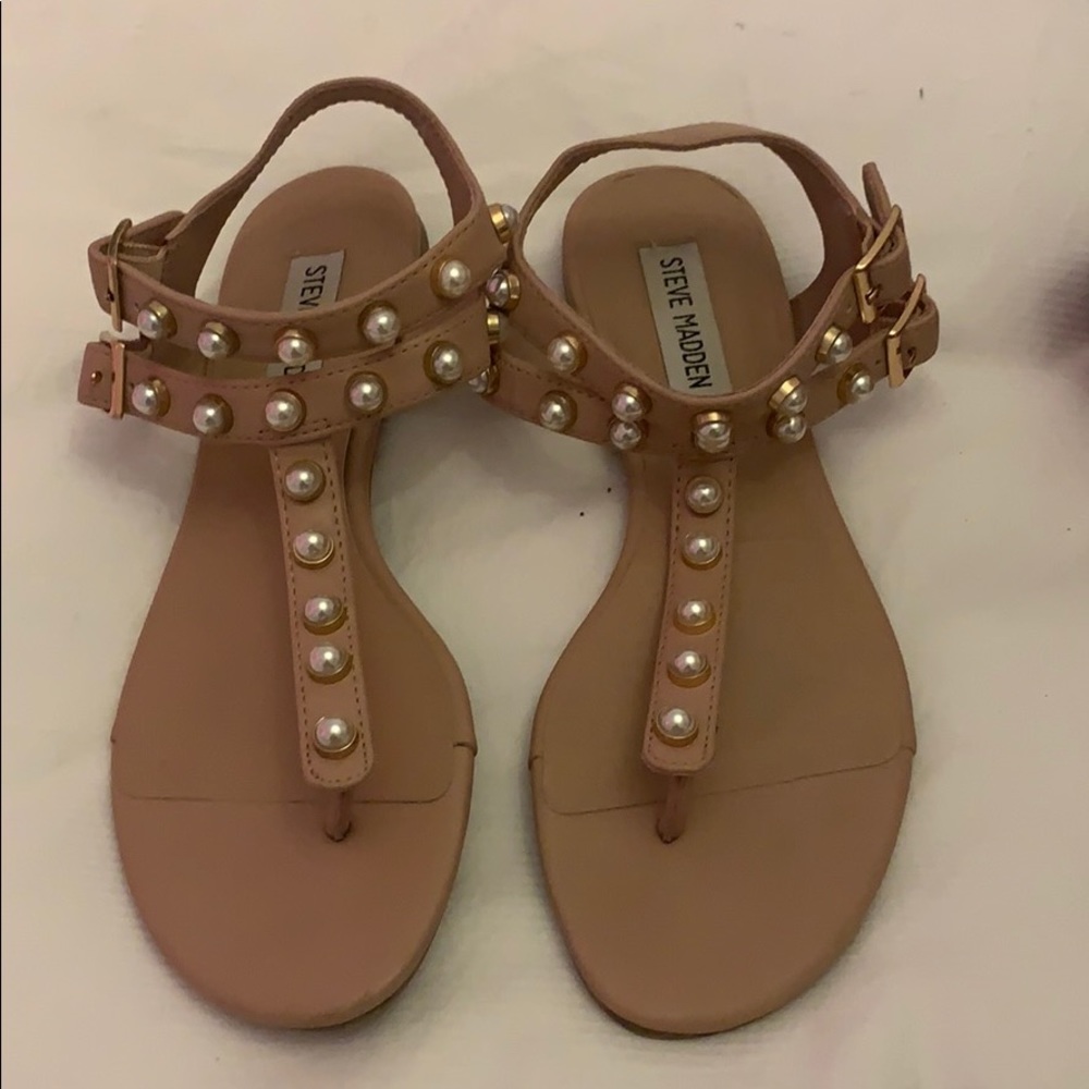 Woman’s nude and pearl sandals